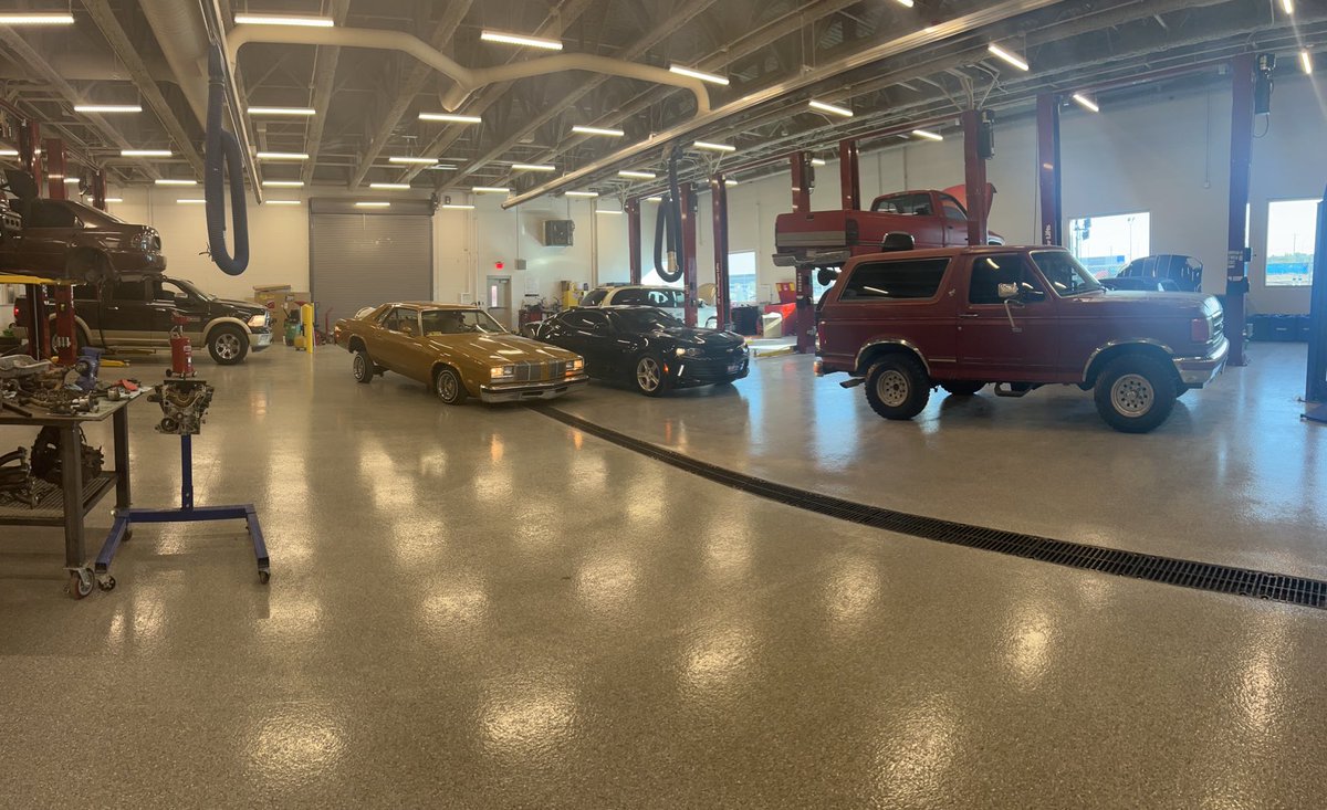 SISD Advanced Auto Students learning from old school to new school.