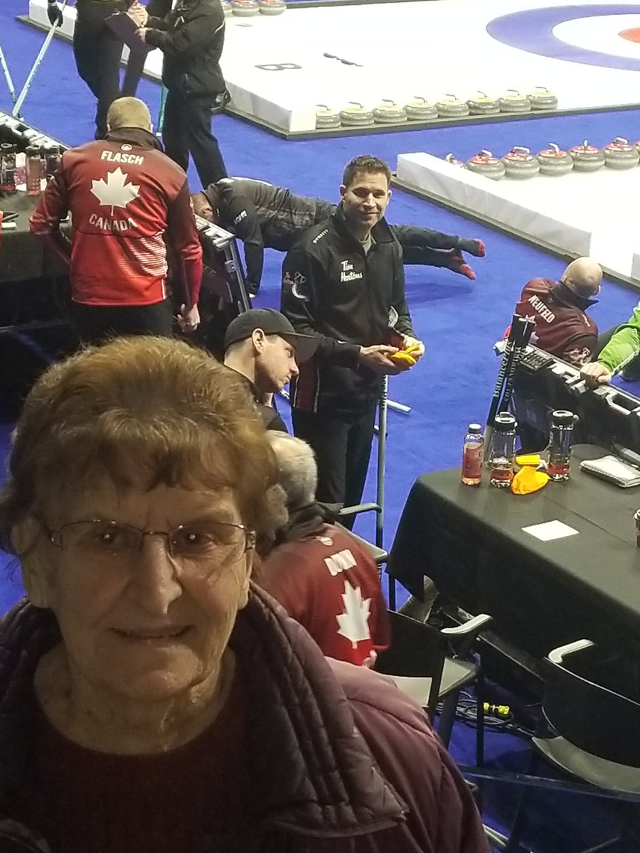 CAPER6921's tweet photo. #TimCurls
I know i'm late for the jacket prize but i wanted to send this pic in.  2019 Brier in Kingston, Ont.  My friend Erla getting a photo with her curling crush John Morris. I had two seats for the entire tourny, many guests sitting in seat #2
#curlingrocks #Timandfriends https://t.co/BRfJjKzu8U