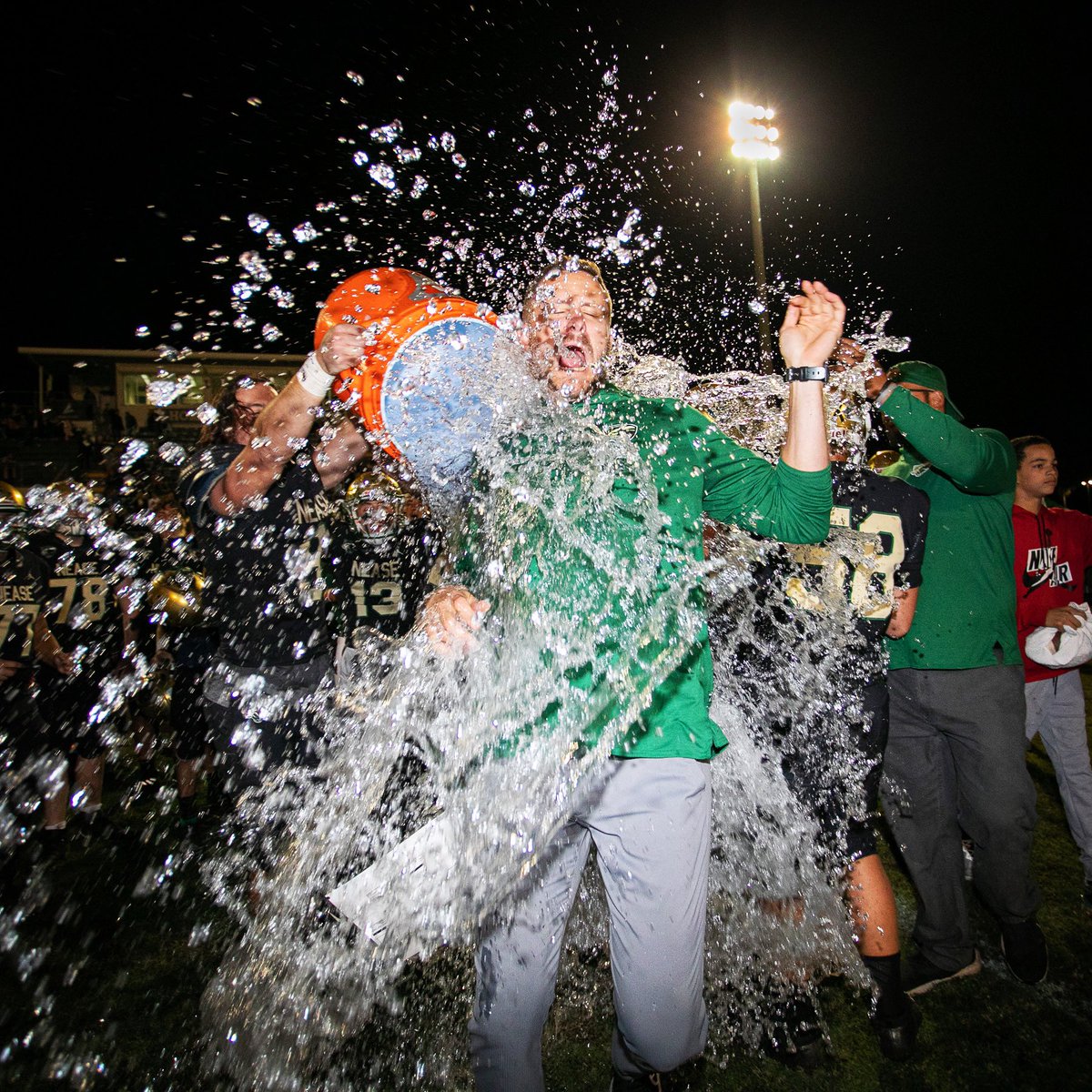 The_Real_Jimmy's tweet photo. Nease Football Coach Collin Drafts is doused with a Gatorade [water] shower on Homecoming &amp; Senior Night after a 39-0 victory vs Westside in their final regular season game. @NeaseFTBL went from 2-8 last year to 7-3 this year under the leadership of @CoachDrafts. #fight https://t.co/UATelHuaUt