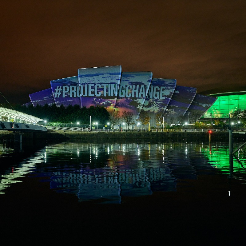 COP26's tweet photo. #ICYMI: World renowned artists, activists and storytellers unveiled a projection on the @SECGlasgow Armadillo last night.
 
The ‘Voices for Earth’ film highlighted the critical actions needed to ensure a path to a regenerative future.
 
#ProjectingChange | #COP26