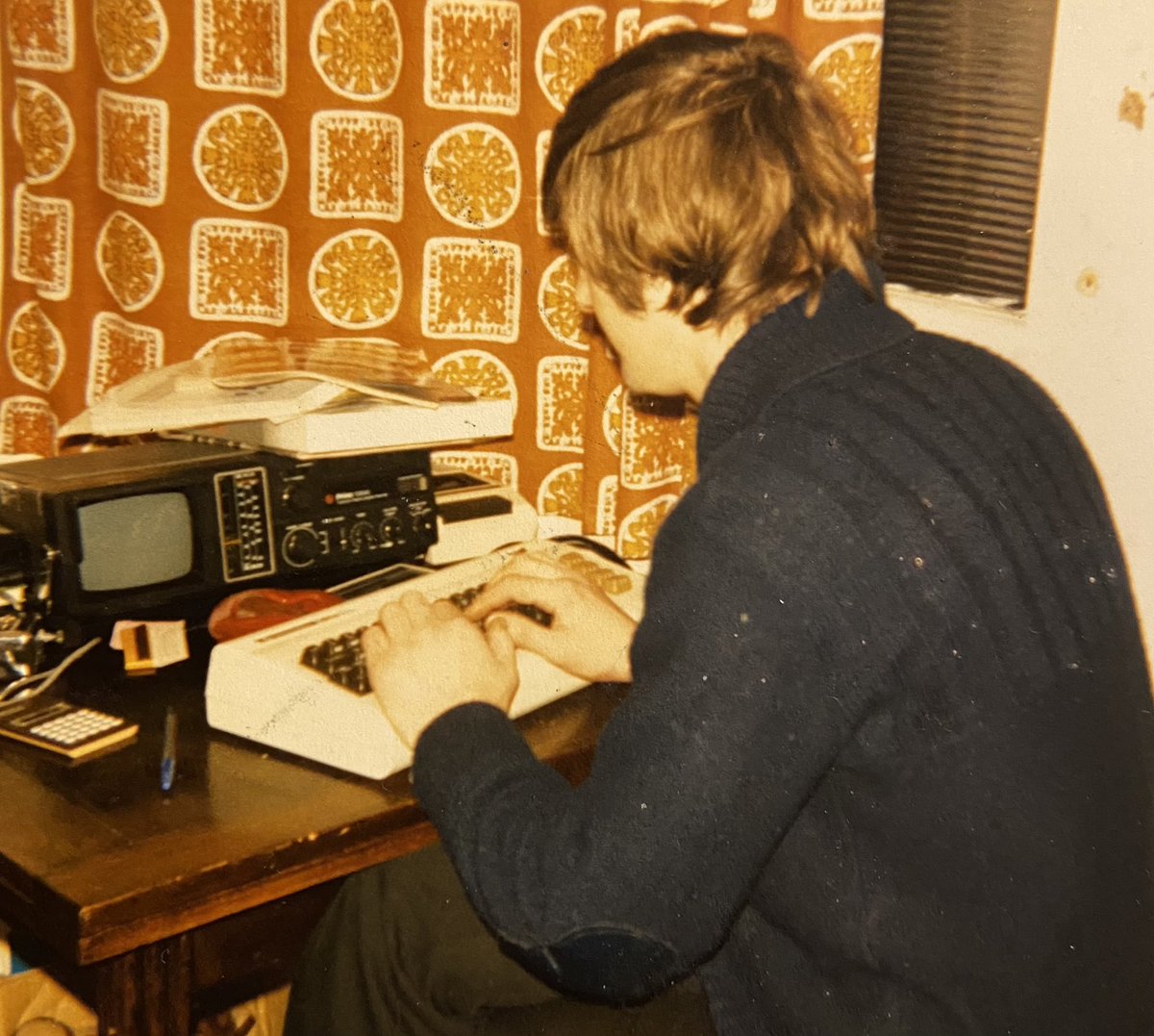 cooperx86's tweet photo. Found a photo of my dad programming a Commodore VIC-20 forty years ago. Look at the size of the screen (!!) 😂 https://t.co/Ja3fspbrZN