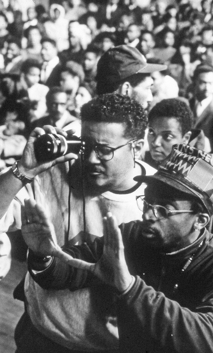 AmericanCine's tweet photo. #ACArchive: Using his finder, Ernest Dickerson, ASC seeks the perfect frame as director Spike Lee suggests a composition during the filming of their historical drama Malcolm X (1992), detailing the life of the slain civil right leader. https://t.co/Z1LZklTBep