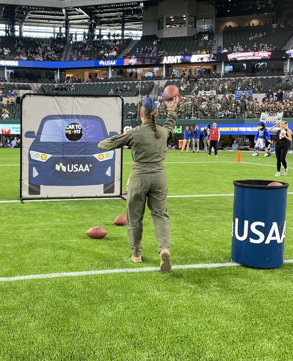 USAA's tweet photo. Twin sisters Emma & Aubrey Kuhrt were on the field representing West Point & the Air Force Academy during the football toss competition (Army won)! Afterwards CMSAF JoAnne Bass presented the pair with her patch! #ARMYvsAF https://t.co/euVCI63v9i