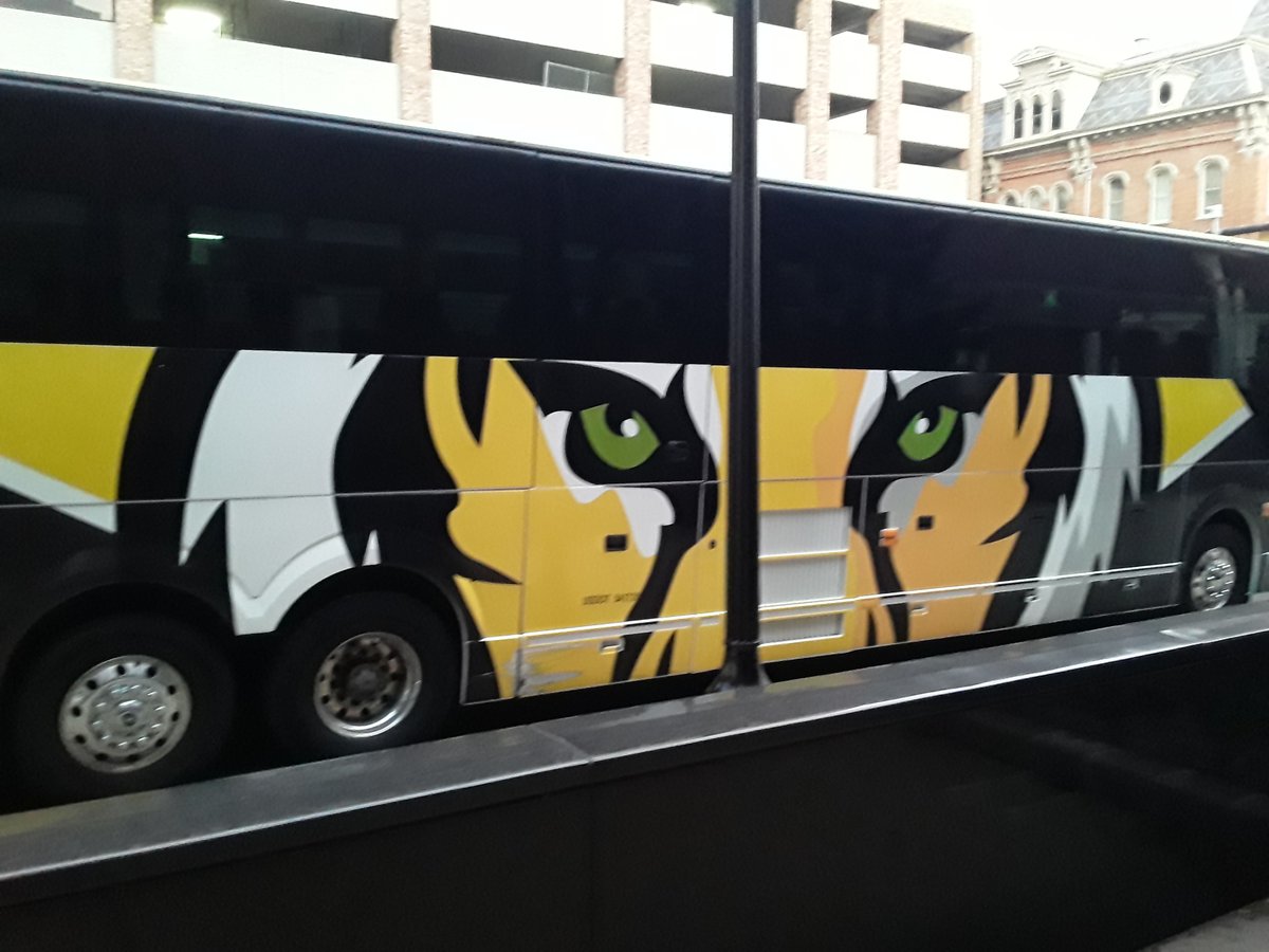 DowntownKazoo's tweet photo. The DePauw University Tigers π― team bus from Greencastle, Indiana parked on the Rose St. side of #RadissonKZOO this morning. Kalamazoo College π swimming & diving is hosting them this weekend for a quad meet. #TeamDePauw https://t.co/oA8qP3w6b3
