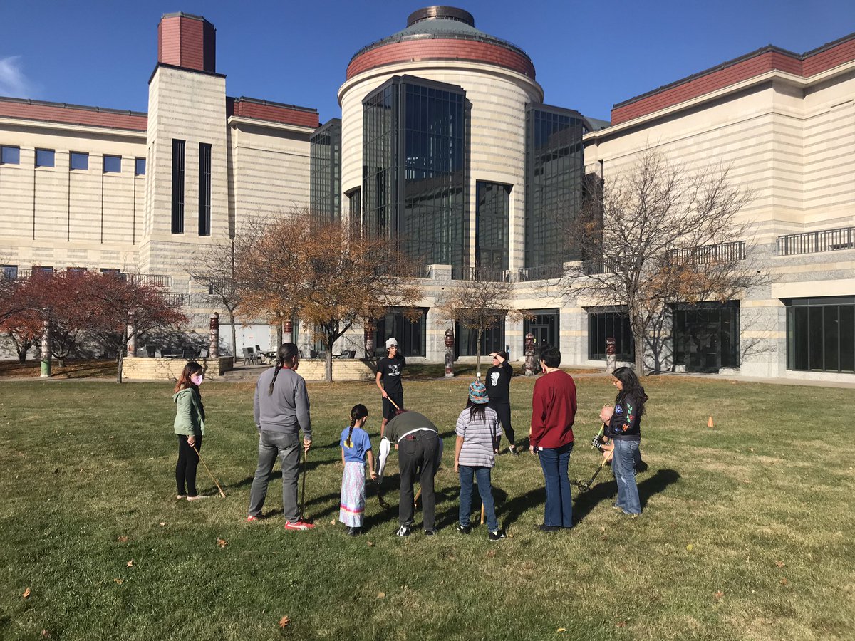 Tc_Native_Lax's tweet photo. #Thakapsicapi (Dakota for ‘ball game’ / lacrosse) and #baagaadowewin (Ojibwe) today on the front lawn of the @mnhs museum. Got to see our ciye Mat Pendleton make an old style canoe. #CreatorsGame #MedicineGame #NativeAmericanHeritageMonth https://t.co/I4pR3t9XDF