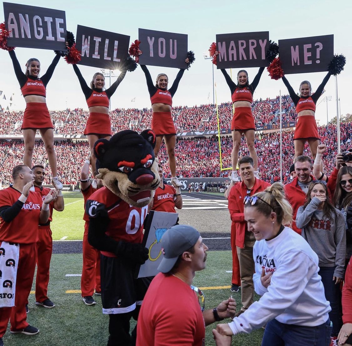 uofcincy's tweet photo. Best day ever? Best day ever! Congrats Angie and Jake! 💍❤️ https://t.co/1SJ4BllBcL