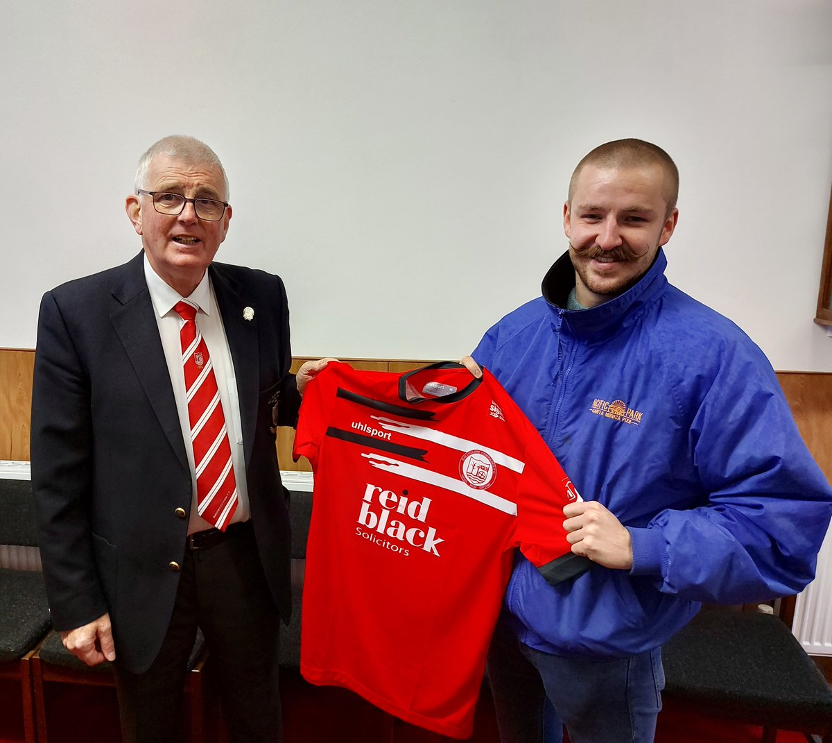 BallyclareFC's tweet photo. Trevor McCann presented our website manager, Scott Gault, with a home jersey to take with him as he departs for a year long work secondment to India. 

Everyone at the club wishes Gaulty all the best on his travels, and we thank him for all his work at the club in recent times. https://t.co/k2OVU3WXL5