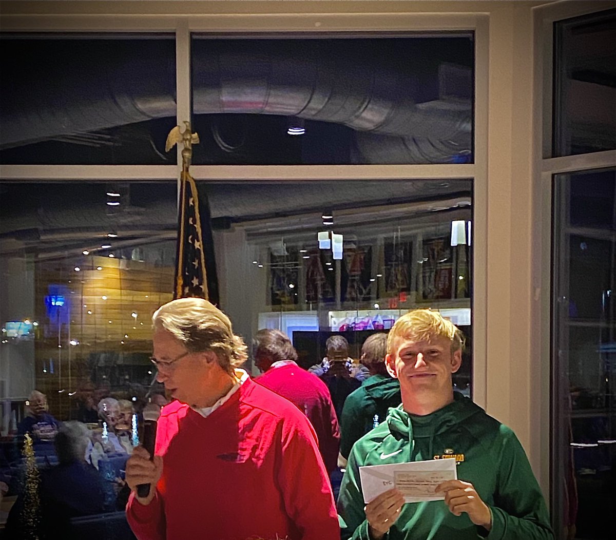 St. Edward Sailing Team Captain and Edgewater Yacht Club Junior Race Team Member Chad Schaffner accepts donation from Larry Read  on behalf of the JRT from the Annual Clambake Regatta. Very generous for the next generation sailors.  #morekidsonsailboats #EYC2021