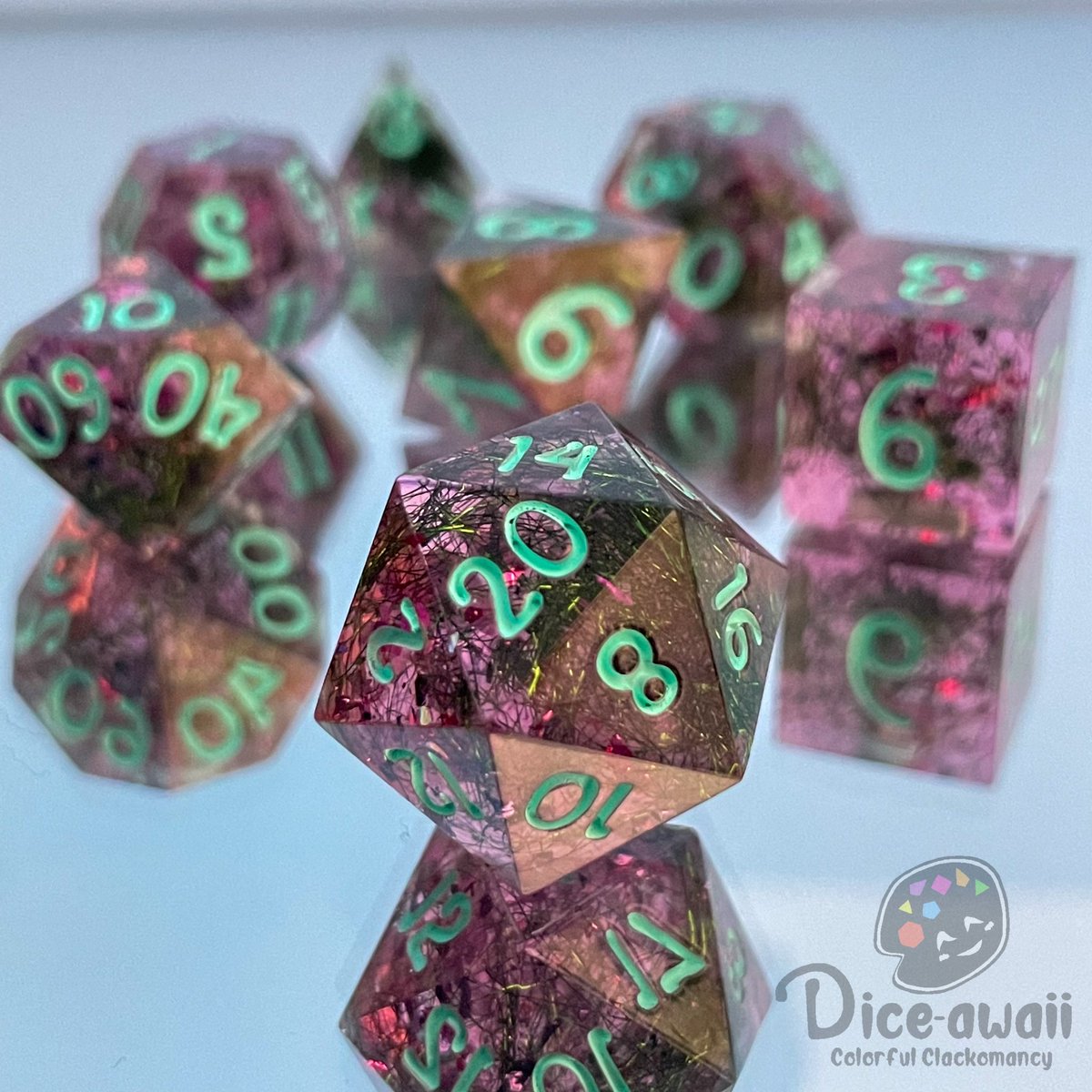Diceawaii's tweet photo. Final finished commission set that is heading out!

PC inspired set of a nymph that is bound to a hyacinth flower. Her name is Hyacella.

I hope they roll well and that they do justice to the character! 💜

(PC Art provided not owned by me)

#handmadedice #dnd #characterdice https://t.co/0T8A9Q9Bmx