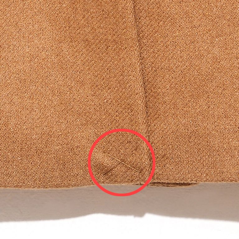 PSA I see this fashion faux pas often around this time of year. Remove the "X" stitch from the back of your new coat. It is only there to keep the vent shut during shipping. You'll move more freely and look more stylish once you take it out.