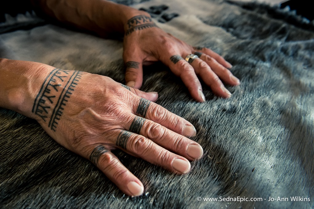 On #InternationalInuitDay, we celebrate our Inuit partners, team members & advisors who've contributed to our ocean knowledge sharing & mobilization program. Aaju Peter's hands rest on a sealskin pelt—her tattoos depict the Inuit legend of Sedna. Photo by Jo-Ann Wilkins #seawomen