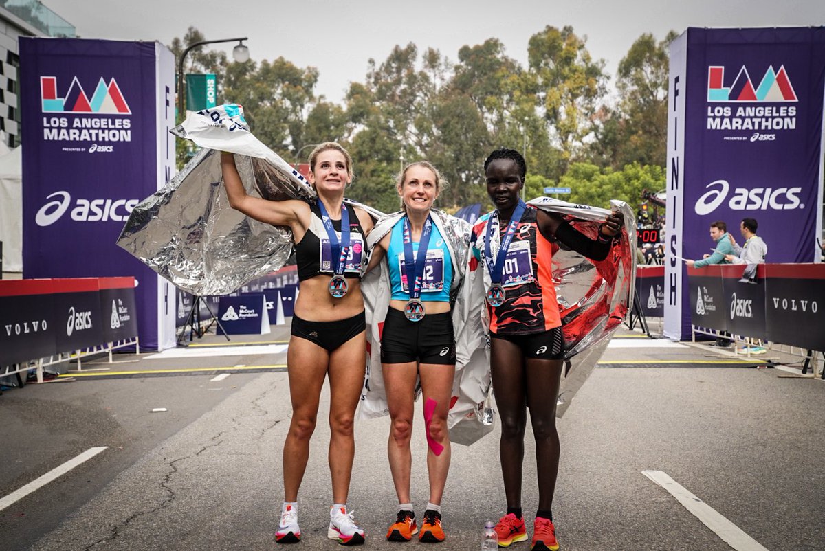 lamarathon's tweet photo. The top three women in the #lamarathon2021: Welsh athlete Natasha Cockram (center, 2:33:17), Kenya’s Antonina Kwamba (right, 2:37:36) and Russia’s Nina Zarina (left, 2:37:37). Congrats, ladies, on your stellar performances! #LAMarathon https://t.co/ZnEbzFGmTt