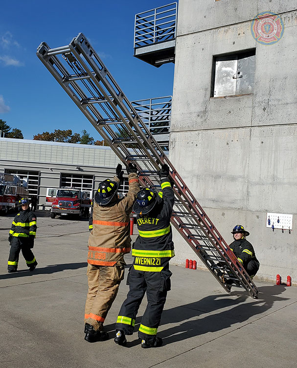 MassDFS's tweet photo. Three #recruits from #Class297 bring the 35 foot ladder to vertical position prior to raising. The 35 foot ladder requires two recruits on the beams and one recruit on the butt to safely, rapidly, and effectively raise the ladder. https://t.co/7Nnuq8JwGi