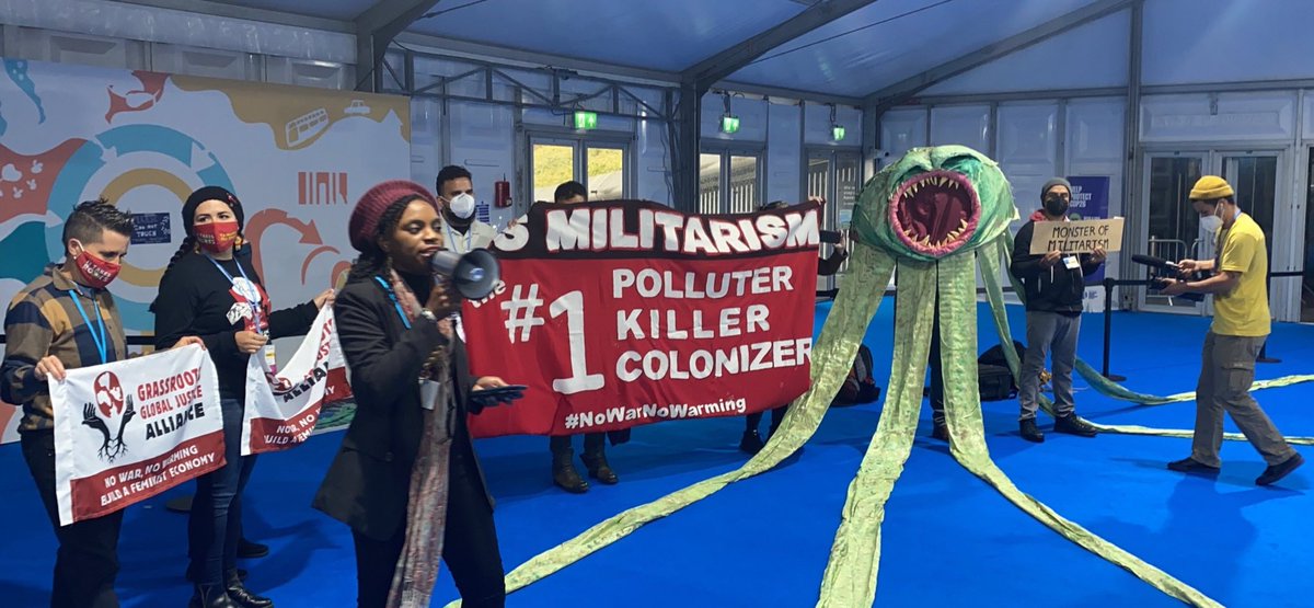 Indigenous_ca's tweet photo. ICA allies @ggjalliance &amp; @ItTakesRoots  action today at #Cop26 to call out US Militarism for contributions to the climate crisis. #NoWarNoWarming https://t.co/Z0GM6puvl3