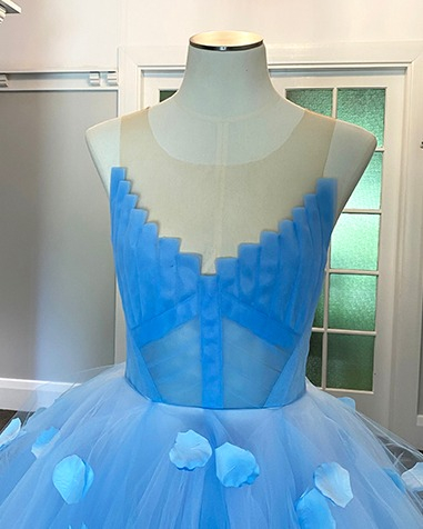 Hand draped and cut tulle details.