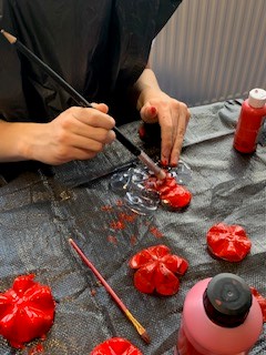PupilSupportDGS's tweet photo. Our P12 and some wonderful student helpers have been making poppies out of plastic bottles.  These Poppies are reusable and will be going on display this week at the Dunbar monument.  Students are really enjoying making these as are the staff.  #RISE #dgs2022 https://t.co/V02wzCcGOv