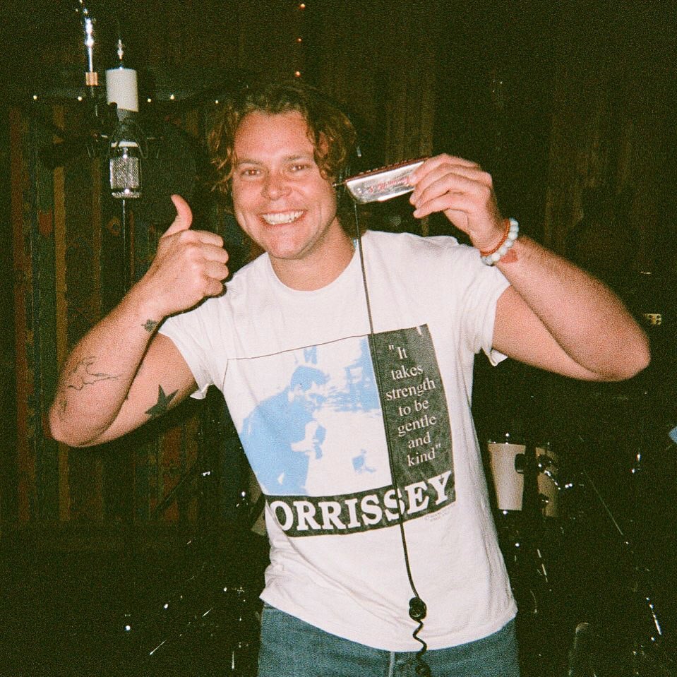 ashton irwin is playing the harmonica on 5sos5!!! this is not a drill