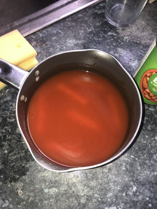 A top down picture of the saucepan filled with tomato juice