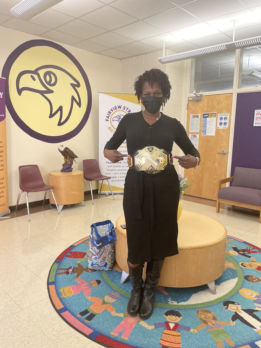 FairviewGCSNC's tweet photo. When your class is one of the Next Level champs for the week, you rock the belt to the fullest! Ms. Carter, one of our awesome Kindergarten assistants, is helping scholars go 
#NextLevel daily in the Eagles’ Nest! https://t.co/q8sld6yGd6