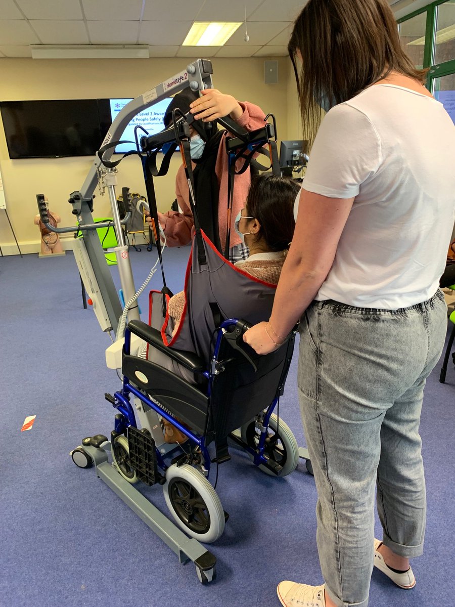 CDCareTraining's tweet photo. Here's a snapshot of Day 2 of the "All Wales Passport" / “Highfield Level 2 Award in Moving People Safely (RQF)”.
Use of the hoist: The volunteer is successfully hoisted up from the chair and placed in a wheelchair. https://t.co/CEW12uYGka