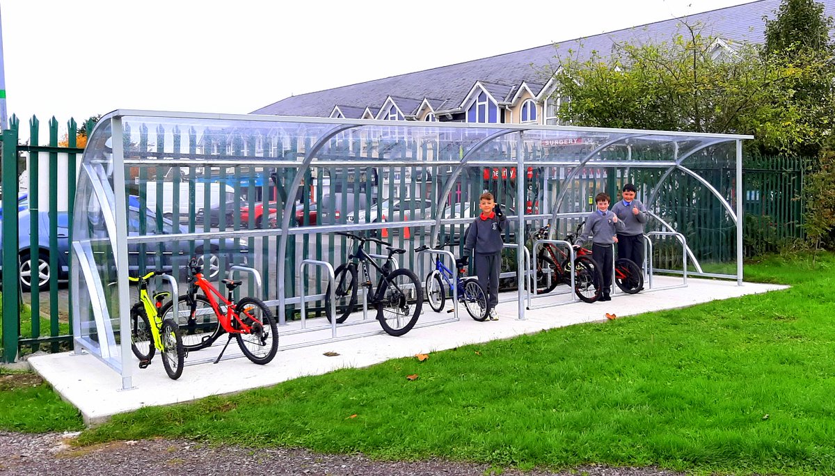 st_navan's tweet photo. #GetToSchool Pupils from Ms McAteer's 4th class pose beside their bicycles at one of our two new sheltered bike racks. These racks are another fantastic addition to the school and ensure pupils have dedicated facilities in which they can "park" their wheels! https://t.co/n35TsQ8jSh