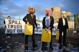 Oil Heads, climate activists from the Ocean Rebellion group, demonstrate outside the INEOS integrated refinery and petrochemicals centre plant in Grangemouth, Scotland, during the COP26 UN Climate Change Conference taking place in Glasgow, on Nov. 2, 2021.
