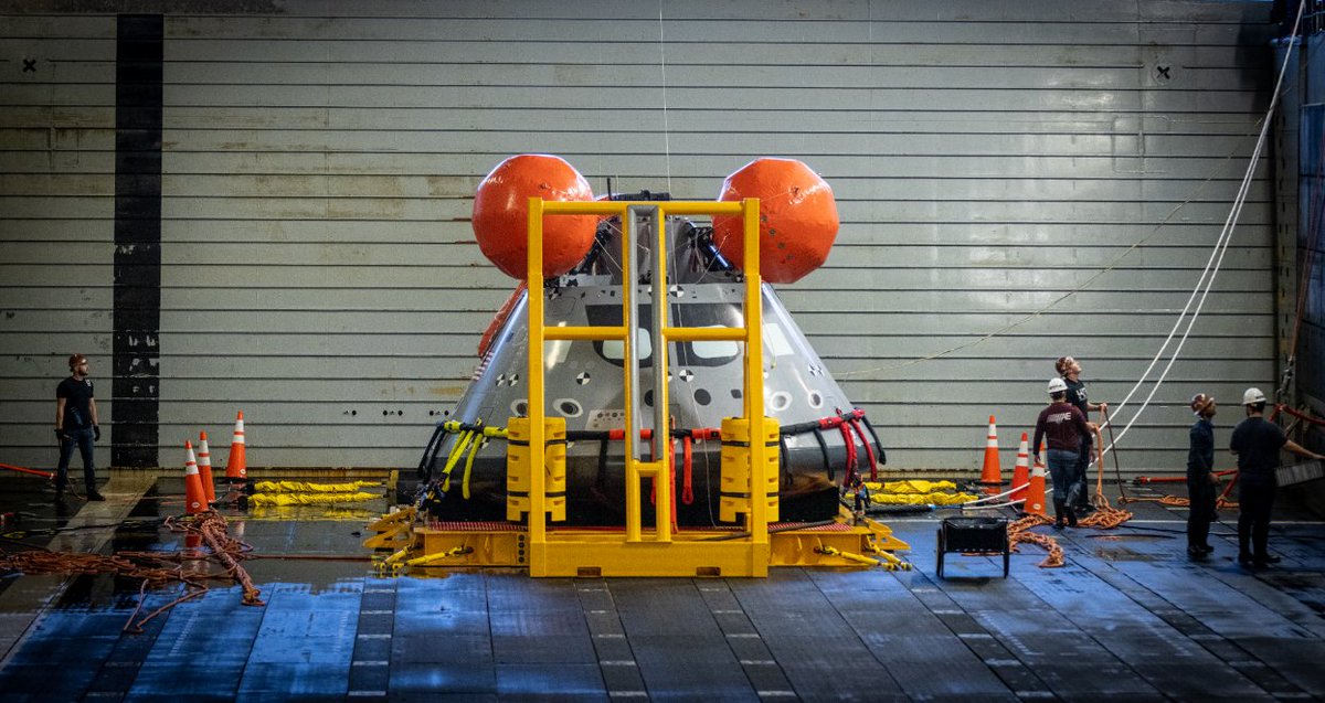 Orion mockup spacecraft sits in a hangar