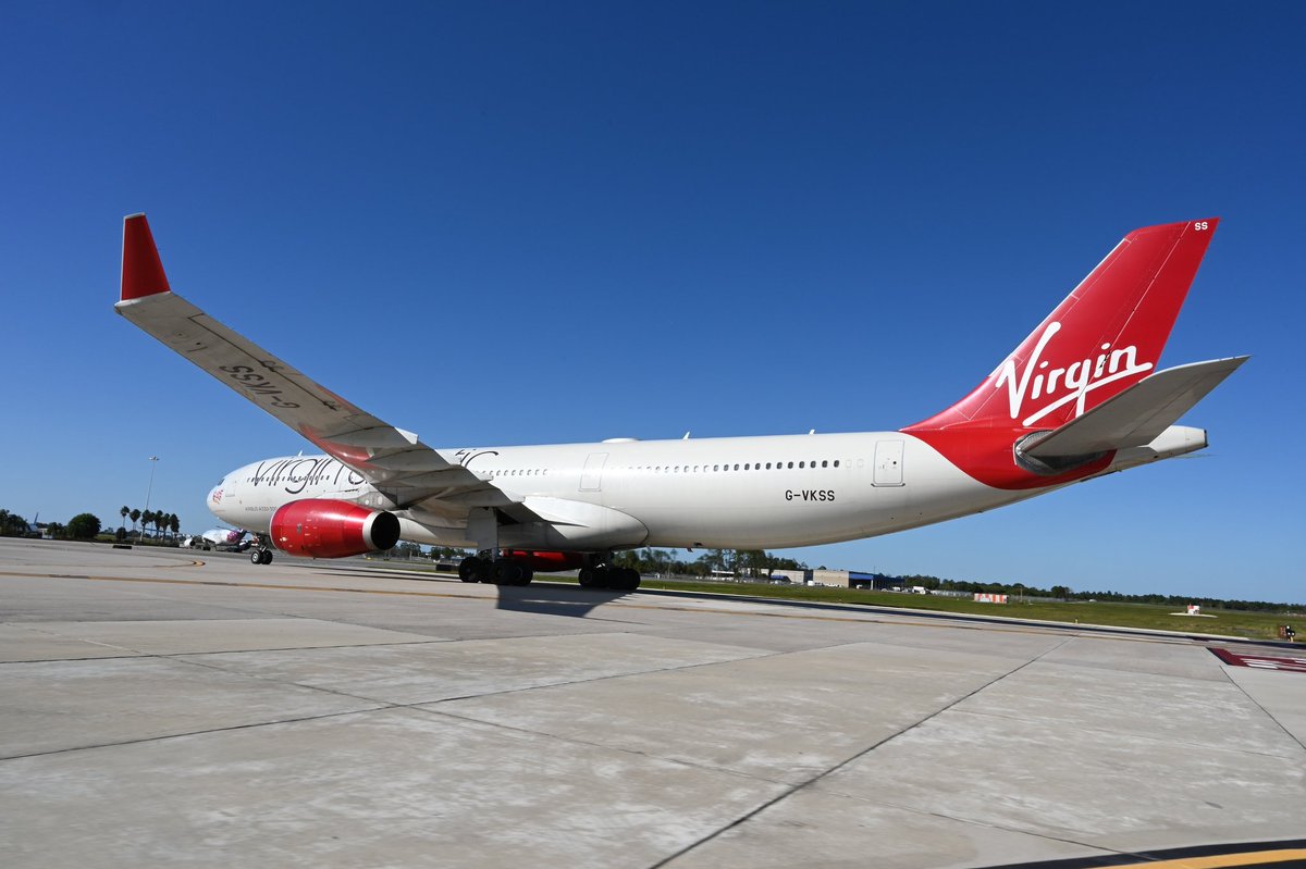 MCO's tweet photo. Welcome, Mademoiselle Rouge! ❤ @VirginAtlantic’s flight from @manairport was the first to touchdown from the UK today, after over 600 days since the US closed its borders. https://t.co/J5Wpq64jtr