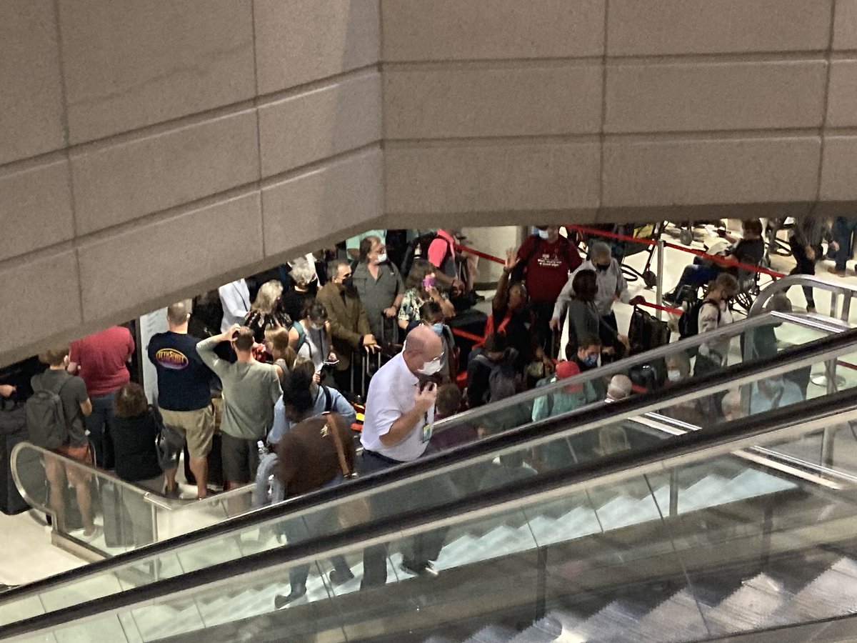 ZachCrenshaw's tweet photo. Sky Harbor is an absolute mess right now.
Tons of confusion. 
A number of the TSA checkpoints have been closed. https://t.co/CJZg1t4zJM
