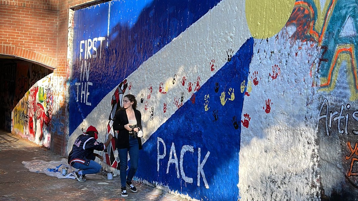 Simp_Courtney's tweet photo. Always happy to celebrate National First-Gen Celebration Day with students, faculty and staff at @ncstate And would you look at this amazing mural designed by one of our awesome TRIO Scholars! #FirstInThePack #CelebrateFirstGen https://t.co/Ix6ATmS6mh