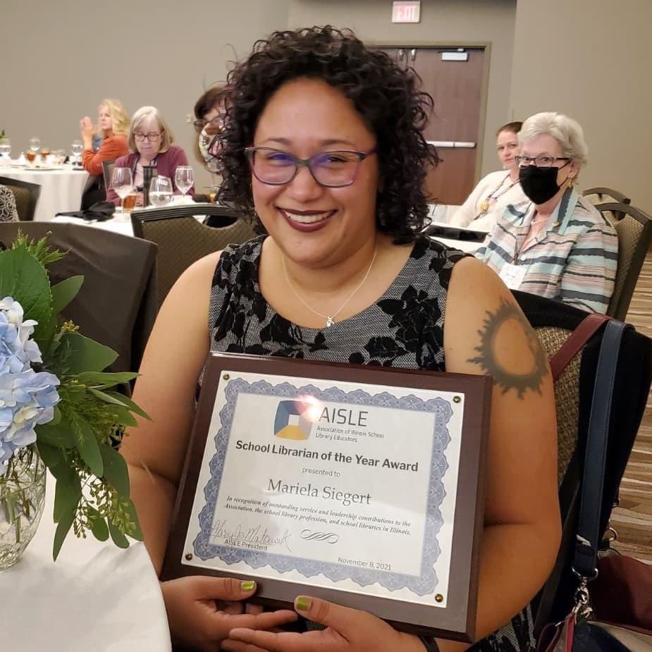 AllisonBava's tweet photo. @DgnLib could not be prouder of our @AISLEd_org School Librarian of the Year, @marris116.  #99learns #weareDGN https://t.co/p8BZ6jPOXY