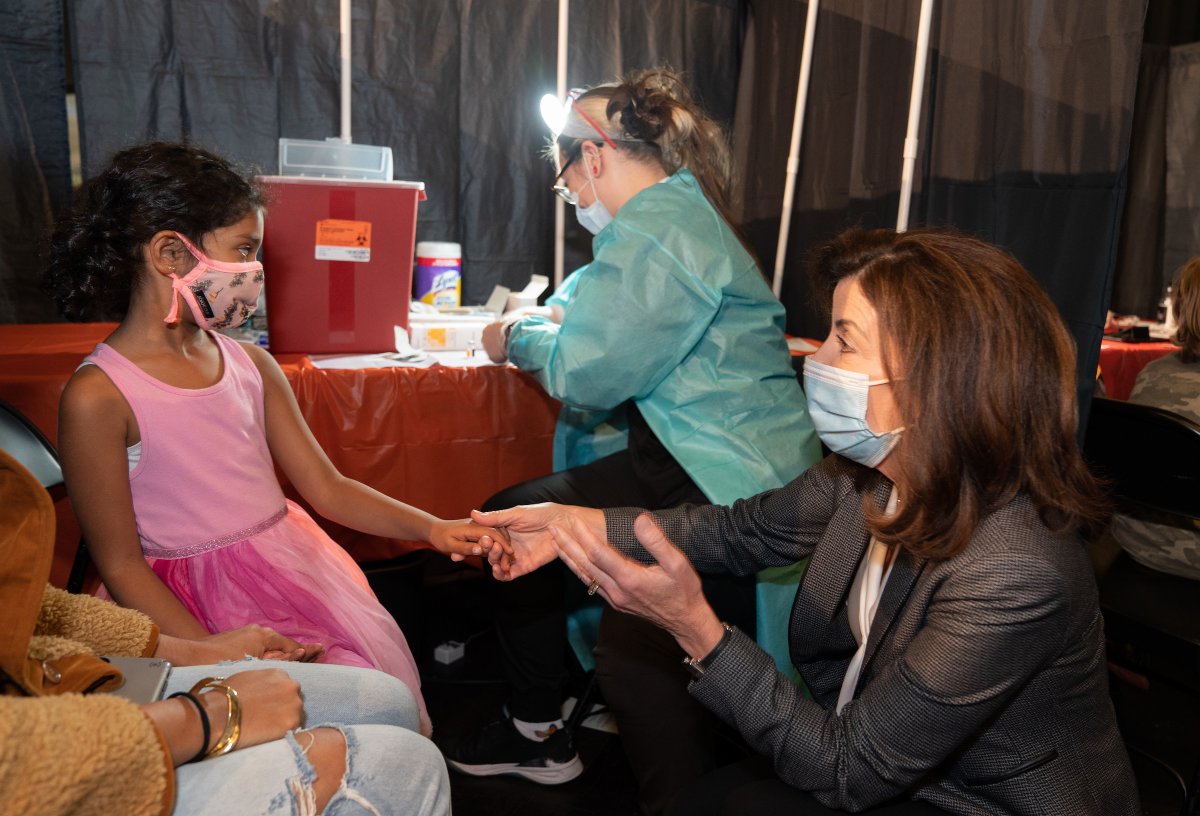 Governor Hochul greets a young child who received the COVID vaccine