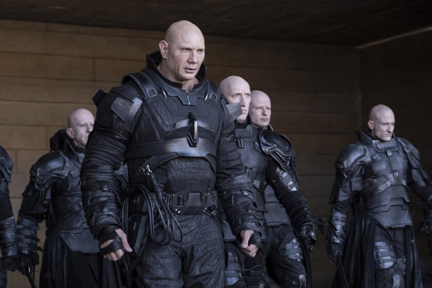 Dave Bautista in DUNE (2021) - all wearing various takes on black armor. © Warner Brothers