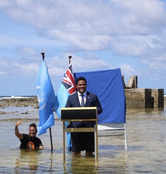 gita_mathew's tweet photo. Tuvalu's foreign minister has given a speech to the United Nations climate conference in Glasgow standing knee-deep in seawater to show how his low-lying Pacific island nation is on the front line of climate change !
“Tuvalu Is Sinking,” PM Tells World Leaders 😢
#GrimReality https://t.co/glbNoaLoIP