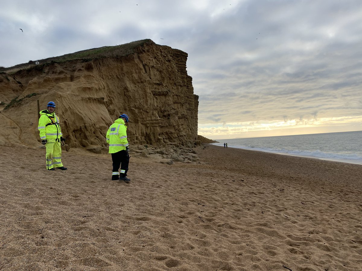 Coastguards are on the scene of a large cliff fall in West Bay