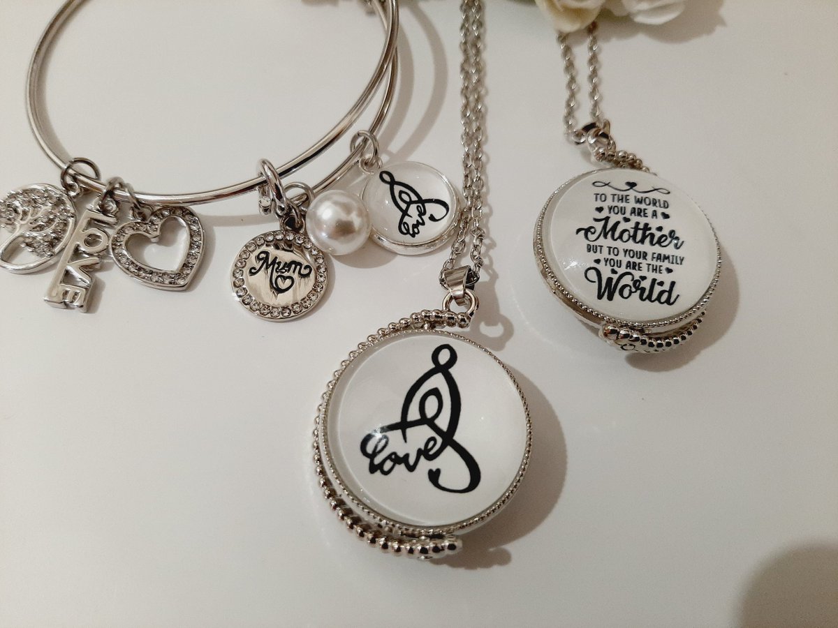 AilishMcKelly's tweet photo. Beautiful Mother's Love rotation pendant and bangle set! The image in the front of this pendant is the oldest representation of the written word Mother found carved onto a stone in Co Kerry in the 4th Century BC https://t.co/qdD7Bd9T3g #customchristmas https://t.co/xgZjHk48Nt