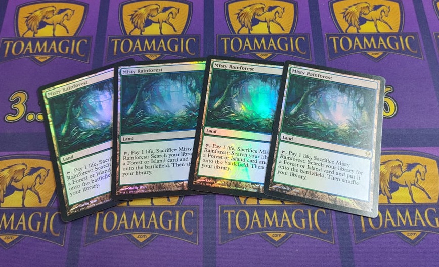 ToaMichael's tweet photo. Reverse auction time! 
Today we have for you a playset of original Zendikar foil Misty Rainforest!
Starting price is $500
Each retweet on this post drops the price by $1 until claimed
Claim by replying "Claim" and follow up in my DMs. https://t.co/RJQzwo8LUk