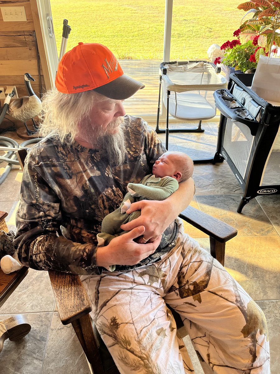 payzo80's tweet photo. Rocking my first grandson in my grandpa’s rocking chair. Best feeling ever! #futurehunter https://t.co/hyzbStpa6a