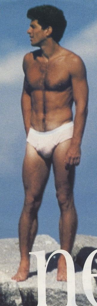 John F. Kennedy Jr. in white briefs while at the beach sometime in the late...