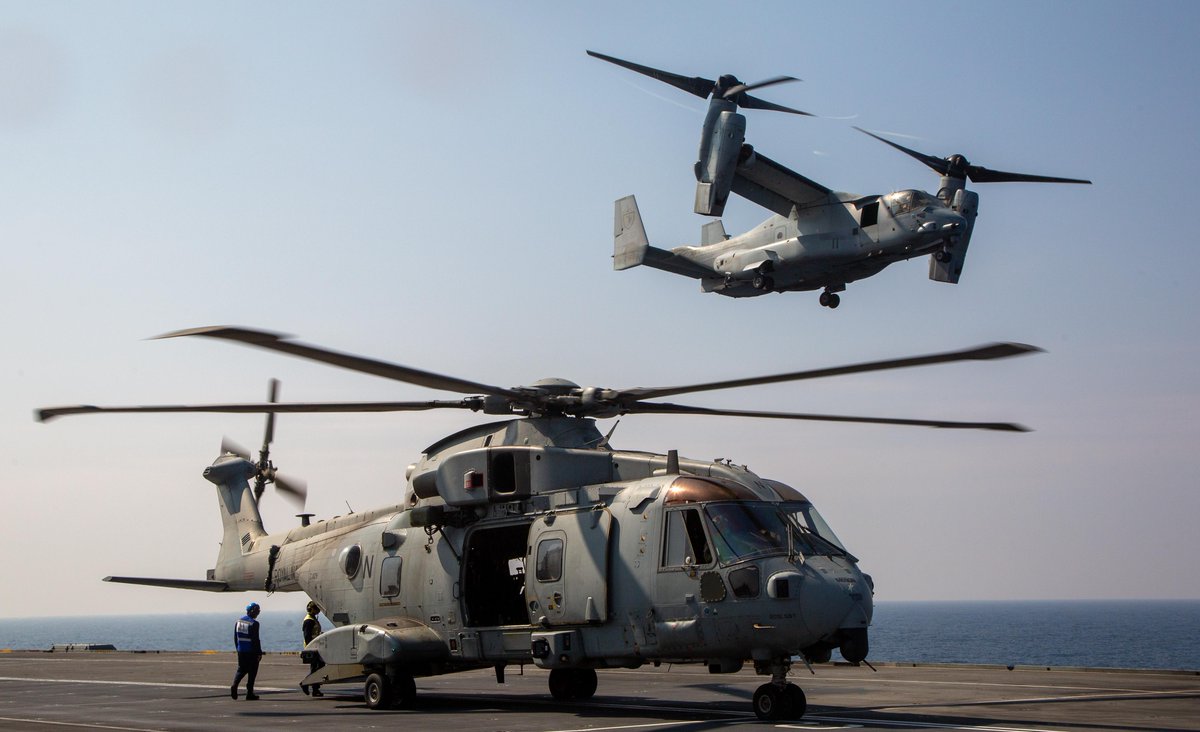 USNavy's tweet photo. #ArabianSea Ops
@USMC MV-22B Ospreys, UH-1Y Venoms and a @RoyalNavy 845 Squadron Merlin MK IV conduct deck landings on @HMSQNLZ while Marine Fighter Attack Squadron 211 cross-decked F-35B Lightning II’s to USS Essex (LHD 2).
2/3 https://t.co/RknQKzoHAv