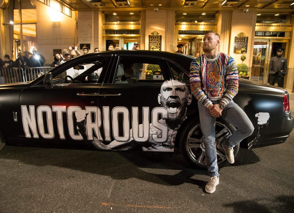 MMAHistoryToday's tweet photo. This week marks the 5 year anniversary of UFC 205 at Madison Square Garden.

This is arguably the most historic event in MMA history.

The UFC's first event at MSG &amp; Conor McGregor becoming the first Champ Champ in UFC history.

He pulled up to fight week in a custom Rolls-Royce. https://t.co/ZEcWasZv3C