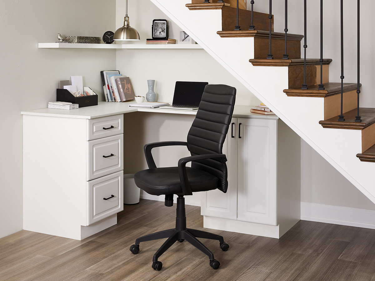 When dimensions are tight, focus on how you can make a space functional. A basement office nook is the perfect way to optimize space under the stairs! bit.ly/3peexLP