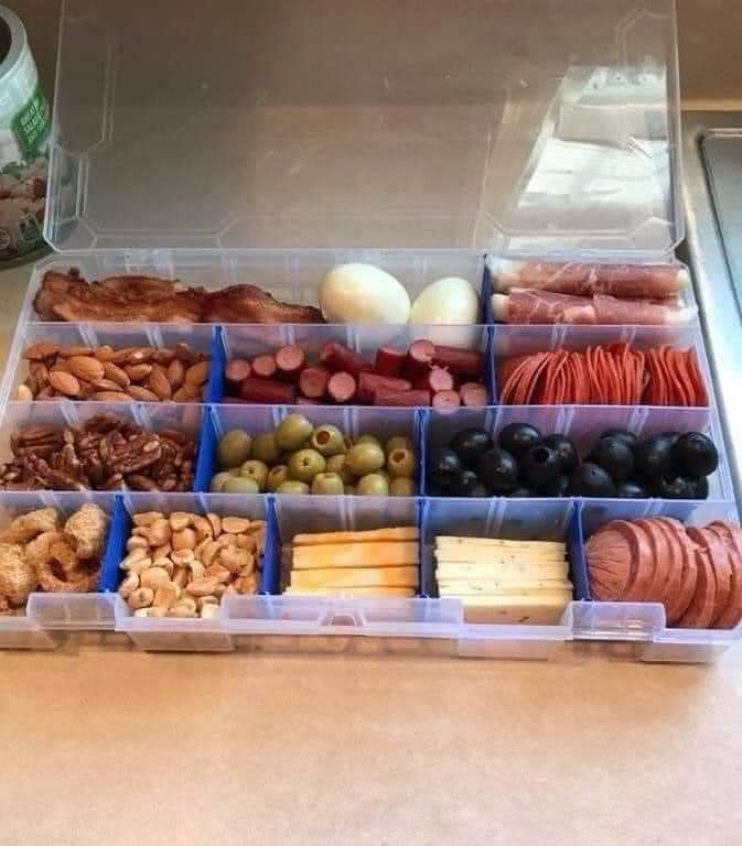 tasty_mia's tweet photo. The #snackle box... #charcuterie in a tackle box ready 4 fishin trips!🤯 Found on a buddy's Facebook. Ppl r geniuses! https://t.co/KGWUP8dcSX