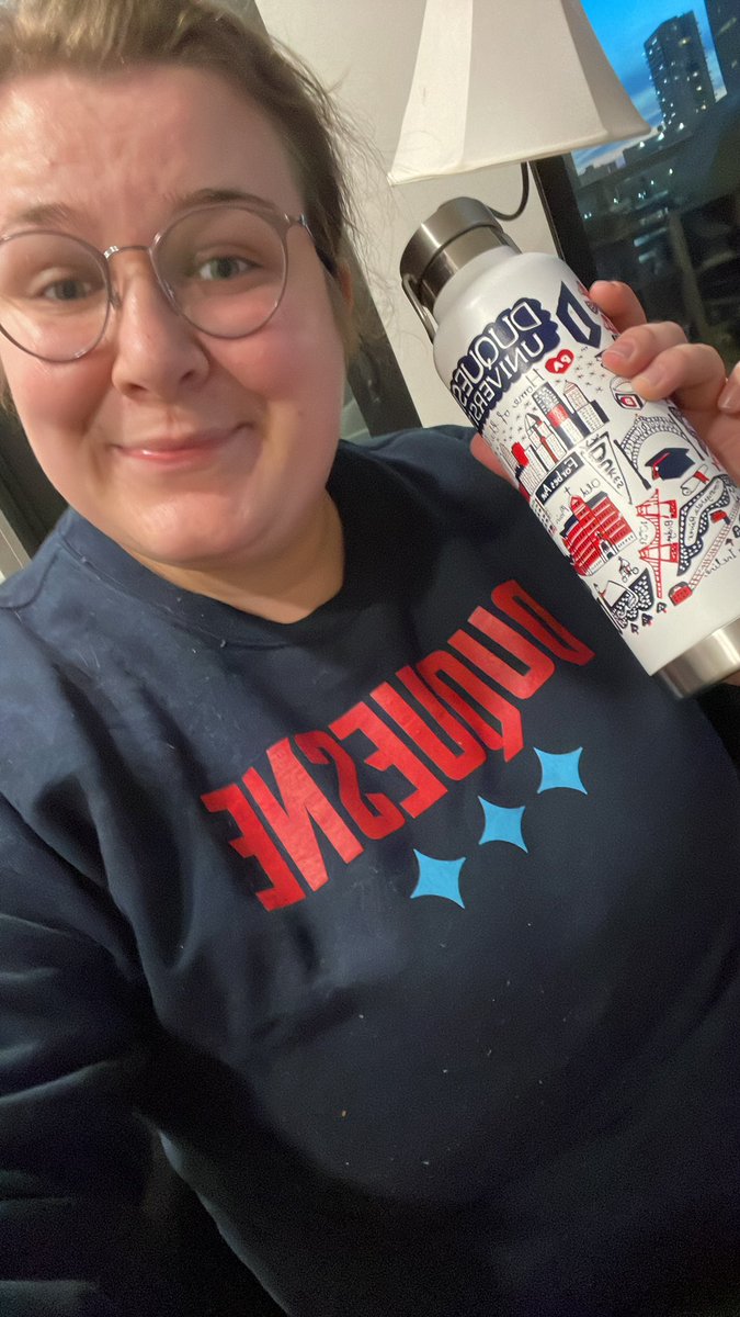AddieCSmith's tweet photo. when you have to do #FanFromHome for @DuqWBB and @DuqMBB because you moved to Minnesota… the gear comes in handy! https://t.co/ftrLF9Spw7