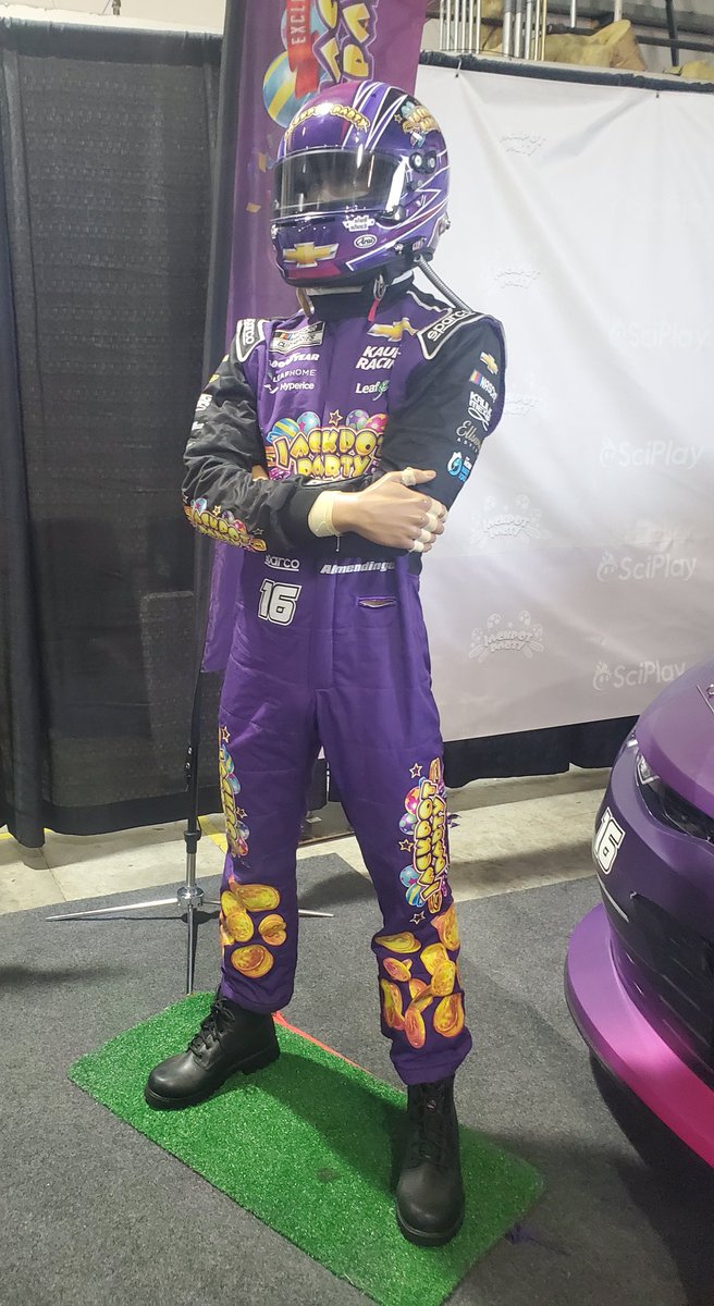 rebkgames's tweet photo. You ever work for a game studio and then get to see a Camaro ZL1 1LE that was driven in the NASCAR Xfinity Series +the suit worn by the driver (A.J. Allmendinger) in your office on a random Tuesday? #PassionToWin #SciPlay https://t.co/PtSVTQ62m6
