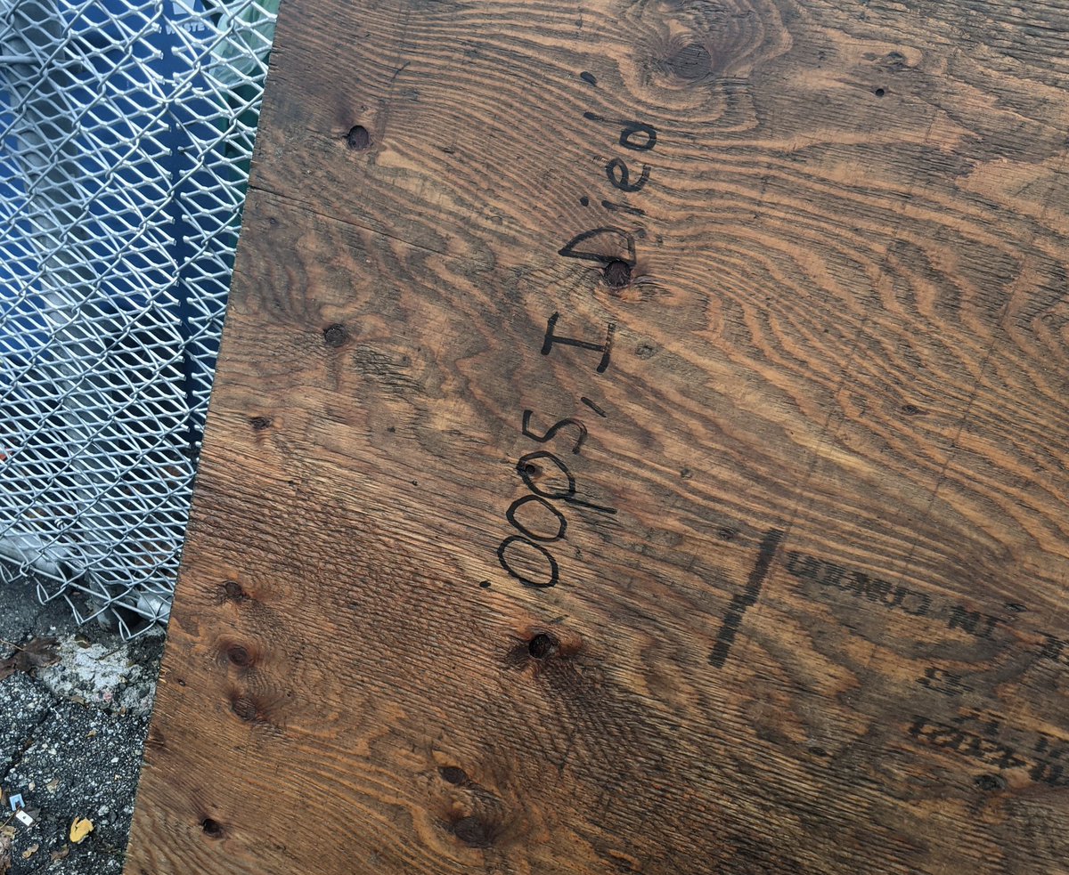 on a wooden board: oops i died