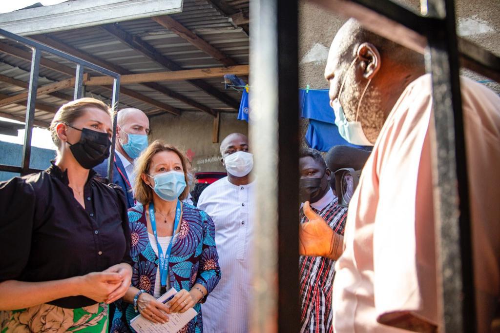 UNICEFGhana's tweet photo. Today, Prime Minister of Denmark Mette Frederiksen, Mr Jakob Ellemann, Ambassador Tom Norring, Ghana Government Officials and UNICEF visited a high density urban community in Tema. We cooperate closely to improve access to water, sanitation, hygiene, health and protection. 🇬🇭🇩🇰🇺🇳 https://t.co/5M6zCI6ern