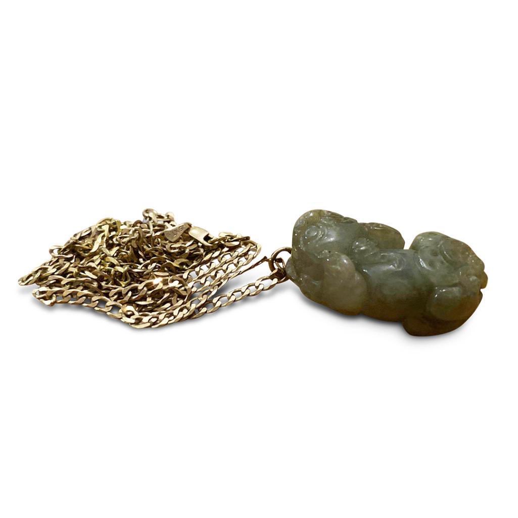 ROSuilleabhain's tweet photo. Interesting piece here #Lot 35 | #CHINESE #HARDSTONE PENDENT ON A 9CT #GOLD CHAIN, the carved hardstone dog of foo mounted with coins, held on a 9ct gold chain, 23.1g total. One of the many pieces of #Jewellery included in the current #auction @HermansAuctions https://t.co/ik9VHXvwl0