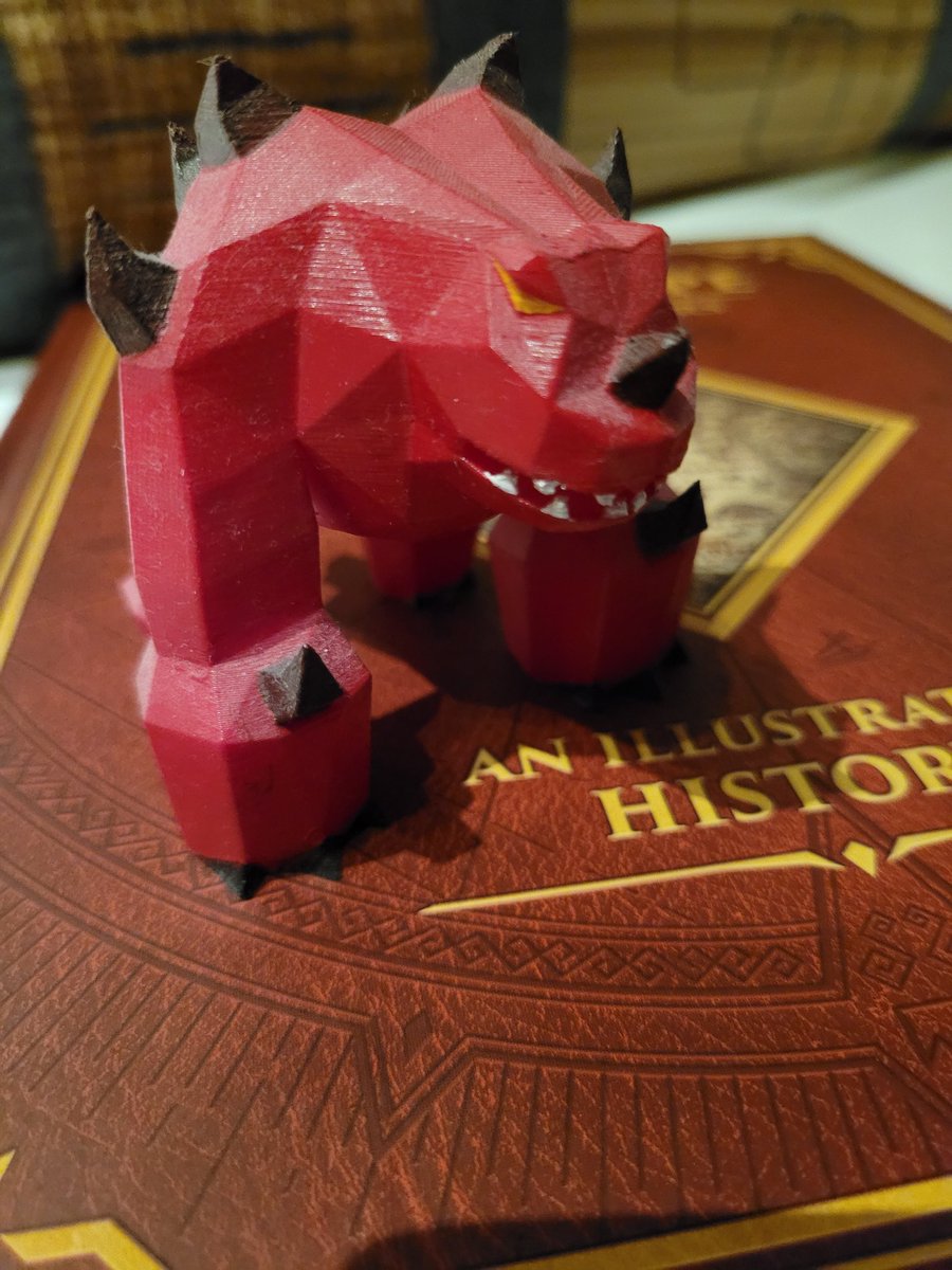 RsElej's tweet photo. He's guarding something! 
Oh, it's RuneScape: The First 20 Years book!!

Jad figure by @EstiOSRS

@RuneScape #RuneScape #20yearsofrunescape https://t.co/BJW5TbpHIz