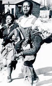 BohHerbert's tweet photo. School children massacred, again. Below left: 24 Nov. 2021 at #EkondoTiti, #SouthernCameroons &amp; (right) iconic #Sharpville, #SouthAfrica photo, 21 March 1960. The reincarnation of the #Apartheid regime in #TheCameroons. #SatanicBiya in the role of #DeKlerk. https://t.co/9uDYtkTYd2